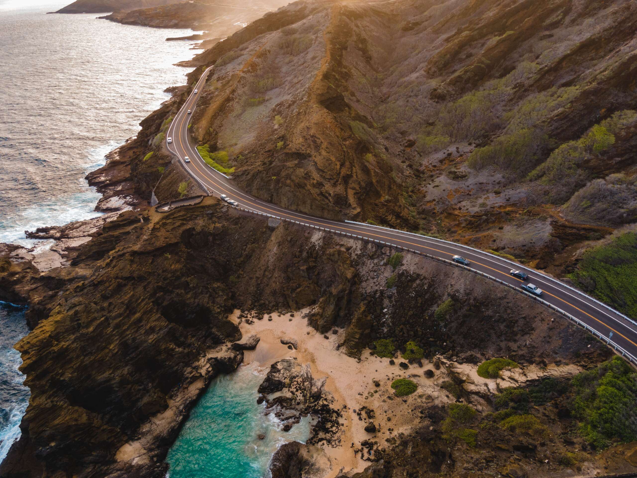 Serene Waimānalo Beach on Oʻahu’s eastern shore, showcasing soft sands, turquoise waters, and lush Hawaiian landscape.